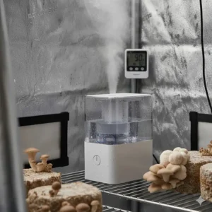 Close-up view of a high-output humidifier inside a mushroom grow tent, demonstrating optimal moisture levels.