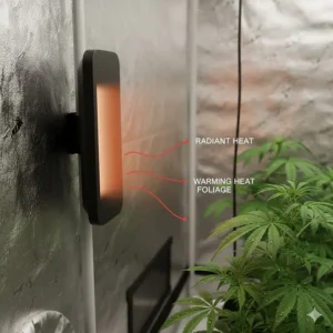 Close-up of a wall-mounted infrared grow tent heater panel, providing gentle radiant heat to the plant foliage without drying out the air.