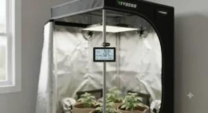Digital hygrometer and thermometer displaying climate stats in a grow tent for beginners.