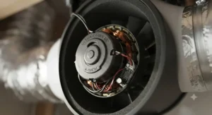 Close-up view of a high-efficiency EC motor on a ultra-quiet 4-inch inline duct fan designed for small spaces.